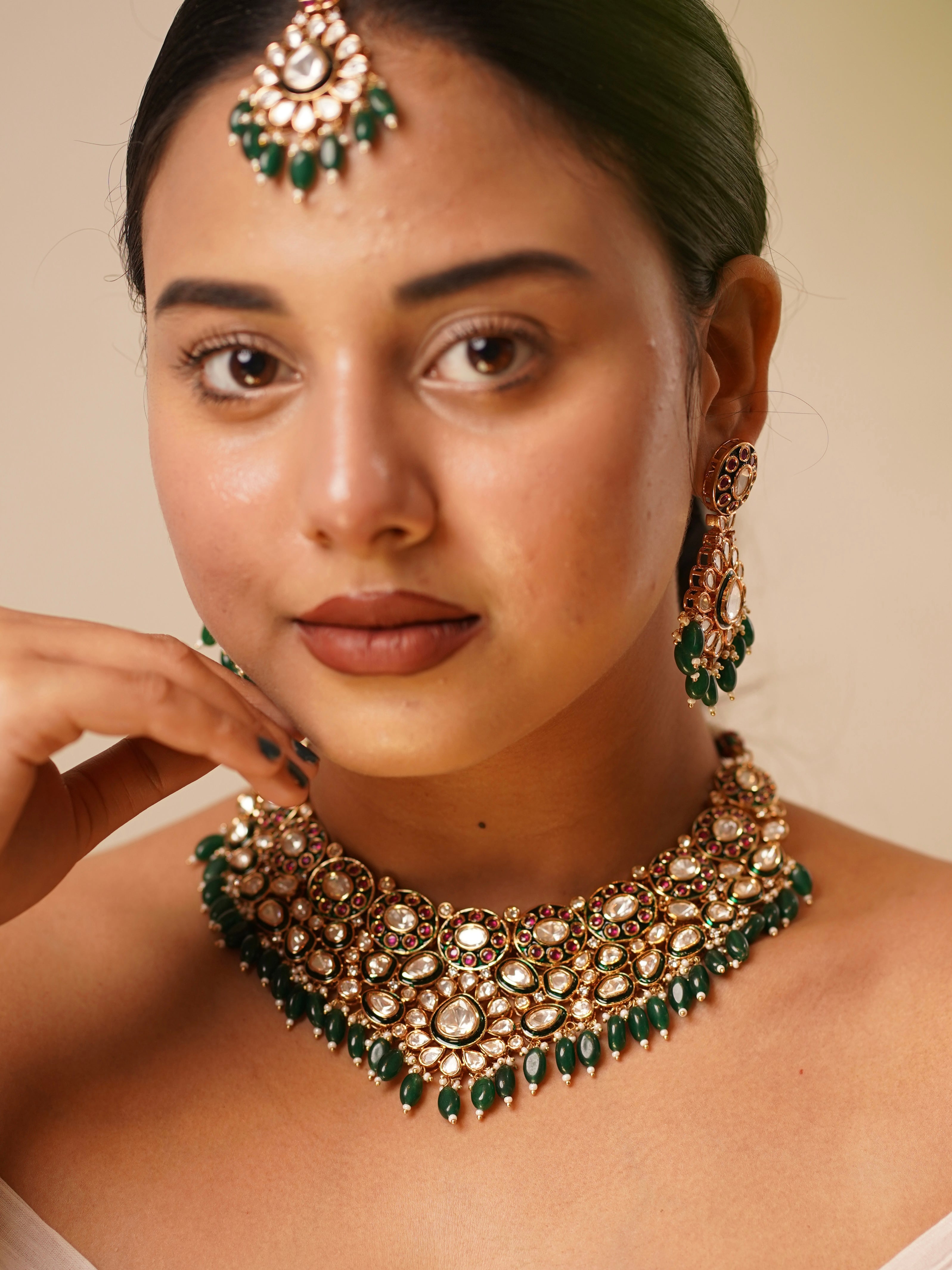 Jadau bridal necklace with polki, kundan, and meenakari work paired with matching earrings